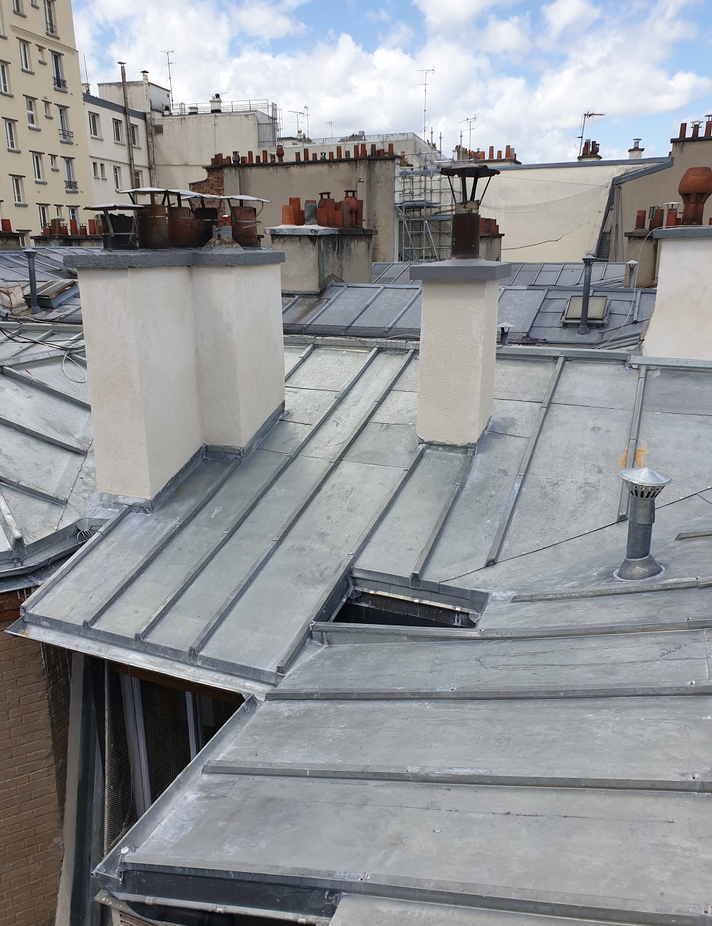 Rénovation de toiture sur immeuble haussmannien Paris 18